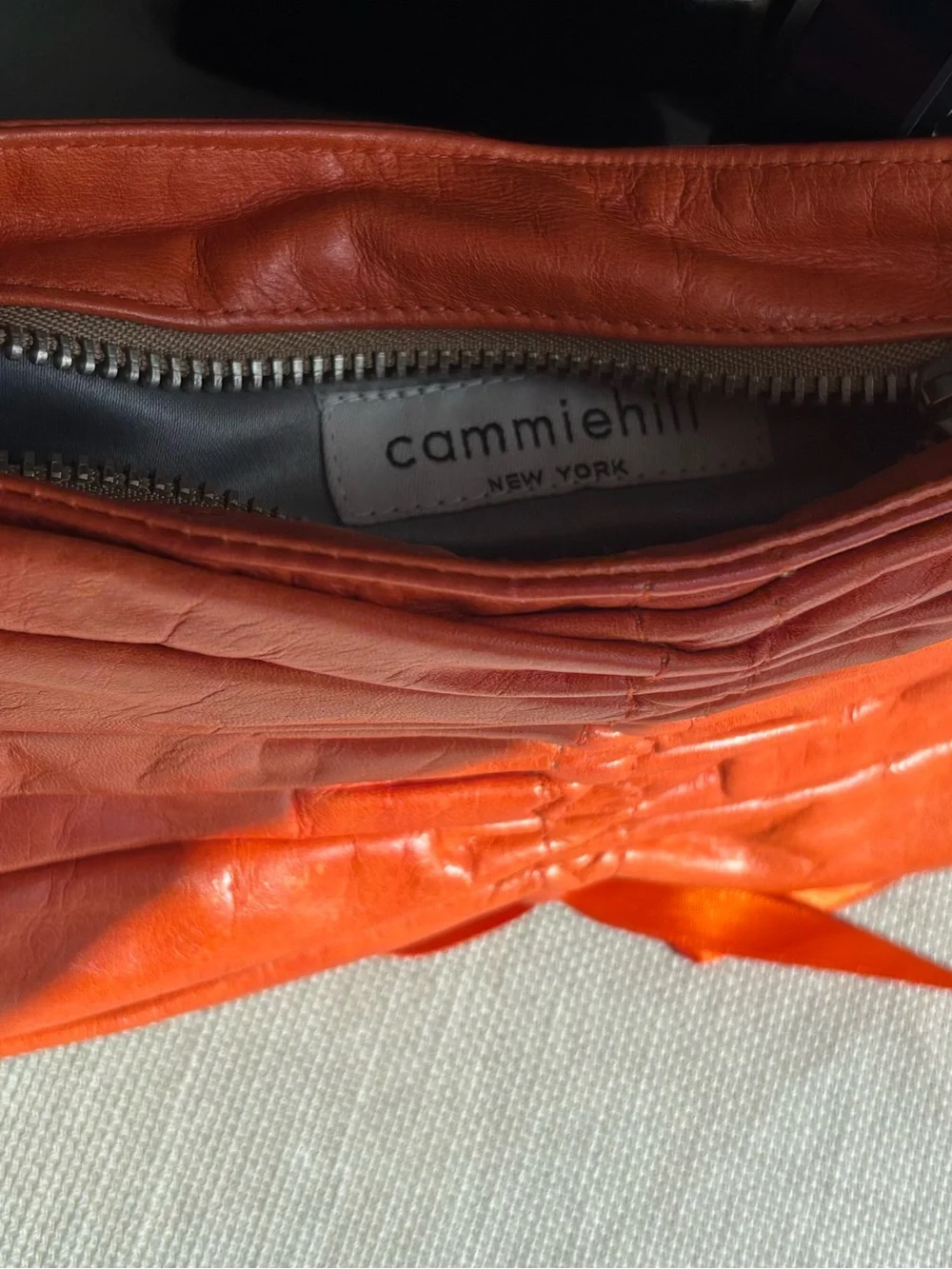 Cammiehill Orange Leather Ruched Clutch
